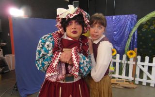 Two actors performing an accessible theatre